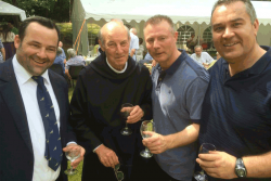 [101] Fr Benedict enjoys a glass of wine with Old Augustinians